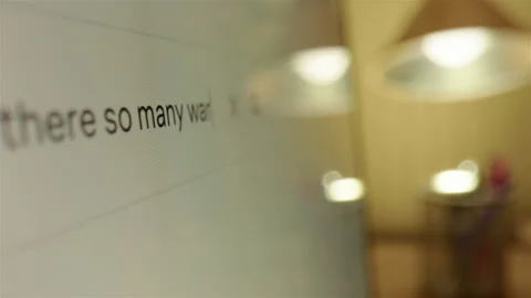 Seeking answers on internet why there are so many wars, typing in search box 库存影片 301591165