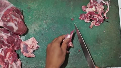 Seen from above cutting beef to make satay Stock Footage 270347410
