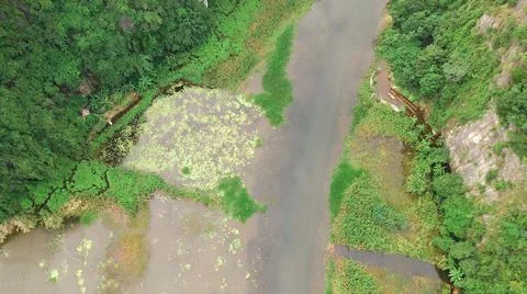 Seen from the air a stream is flowing down from the mountain Foto stock