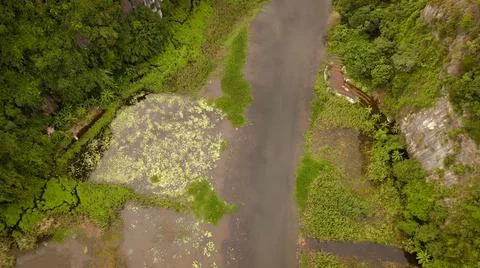Seen from the air a stream is flowing down from the mountain Foto stock