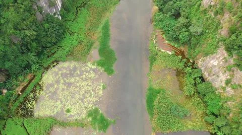 Seen from the air a stream is flowing down from the mountain Foto stock