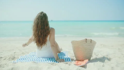 Seen from behind modern 40 years old woman on seacoast Stock Footage 274492222