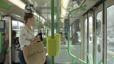 Seen from inside tram stop people boarding Stock Footage 172560462