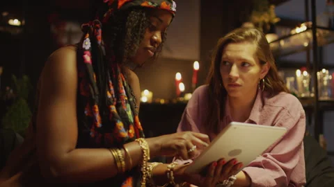 Seer and Client Looking at Tablet when Having Session Stock Footage 247630959