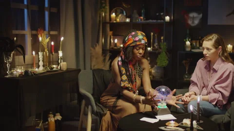 Seer Having Session with Crystal Ball when Predicting Future of Woman Stock Footage 247631485