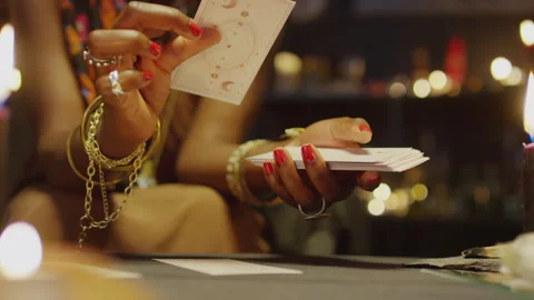 Seer Looking at Tarot Cards when Doing Layout Stock Footage 247635989