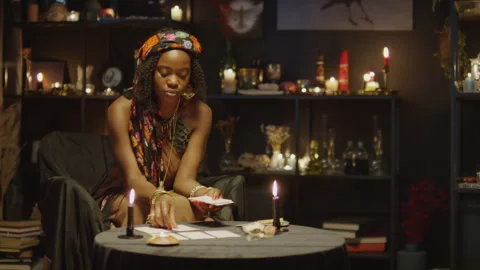 Seer Making Tarot Card Layout on Table Stock Footage 247636394