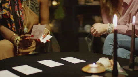 Seer Reading Tarot Cards when Predicting Clients Future Stock Footage 247627805