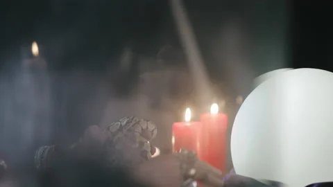 Seer using serpent and magical ball foreseeing future Stock Footage 136883765