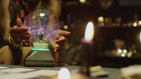 Seers Hands Touching Crystal Ball with Blue Lightning Inside Stock Footage 247638548