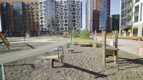 Seesaw spring balancer and small slide on gravel playground Vídeo Stock 330283646