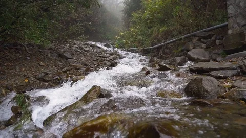 Seething clean clear mountain river waterfall flowing slow motion Stock Footage 125616398