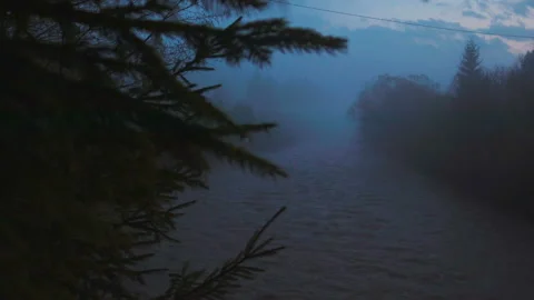 Seething mountain river in the dark and fog Stock Footage 107922443
