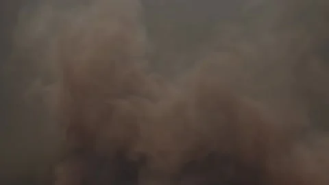 Seething streams of gray suspension are approaching the chamber. Dust storm. Stock Footage 169674336