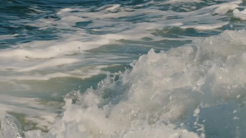 Seething wake of white foam and spray from running motor behind boat on surface Stock Footage 327346551