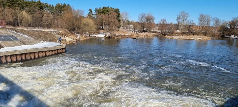 Seething water at the dam in the spring Stock Photos