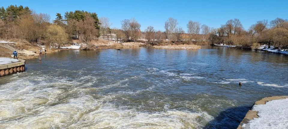 Seething water at the dam in the spring Stock Photos