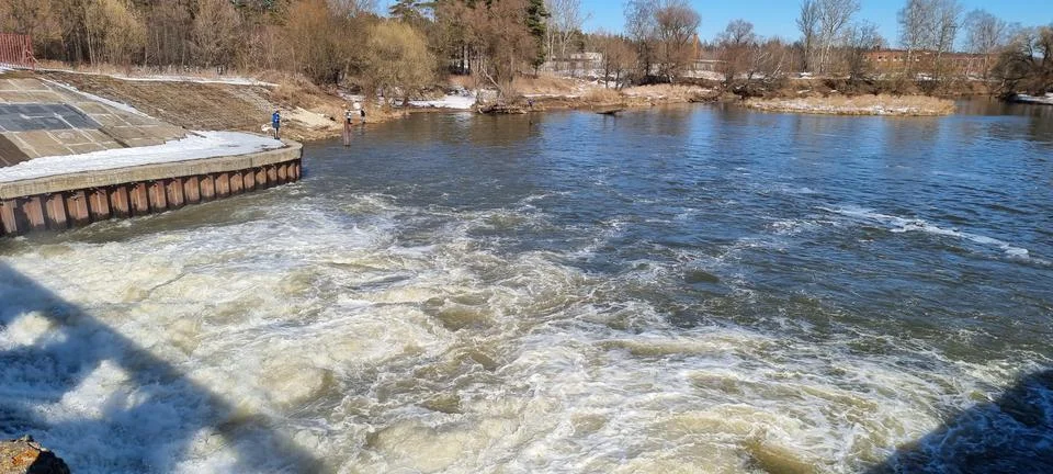 Seething water at the dam in the spring Stock Photos