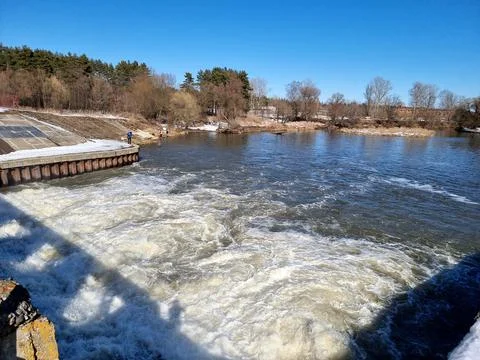 Seething water at the dam in the spring Stock Photos