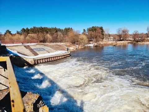 Seething water at the dam in the spring Stock Photos
