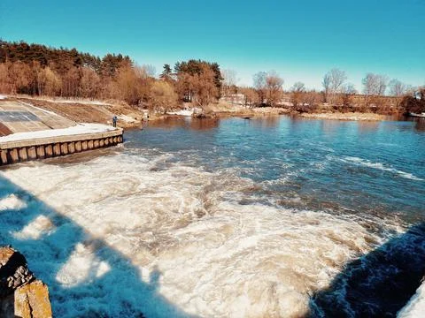 Seething water at the dam in the spring Stock Photos