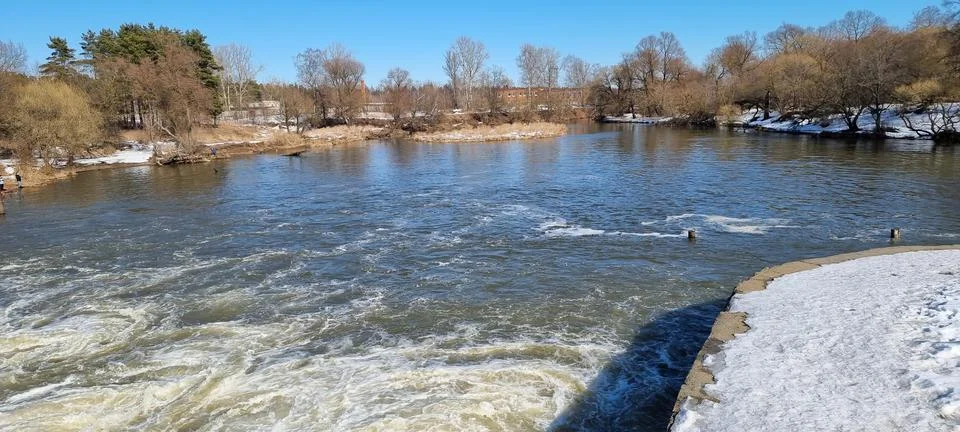 Seething water at the dam in the spring Stock Photos