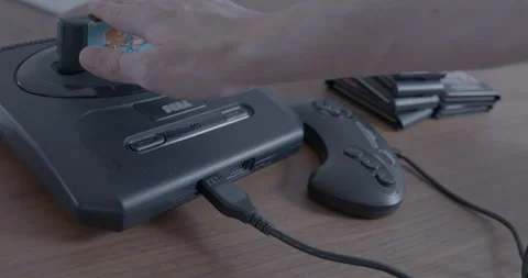A  Sega Genesis  video game console is turned on Stock Footage 154483755