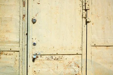 Segment beige rusty garage door.	 Stock Photos