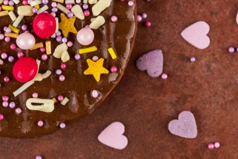 Segment of a chocolate biscuits sprinkled with colourful candy Stock Photos