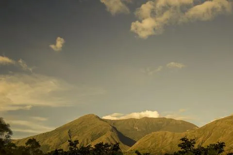 A segment of the eastern Andes range of central Colombia illuminated by the l Stock Photos