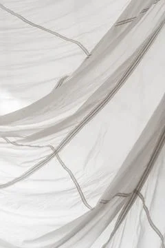 Segment of folded white parachute fabric closeup. Stock Photos