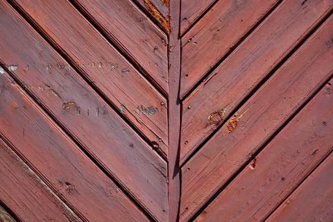 Segment of the old red gate from the boards.	 Stock Photos