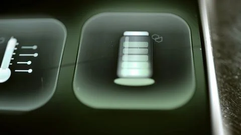 Segmented battery icon glows in one rounded square Stock Photos