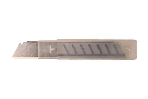 Segmented utility knife blade in protective translucent plastic storage case Stock Photos