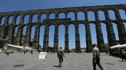 Segovia men meet by aqueduct Stock Footage