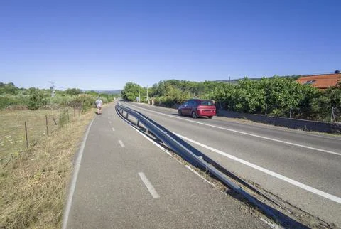 Segregated cycle lane running parallel to a local road 库存照片