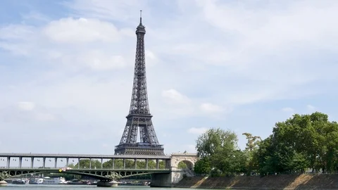The Seine (paris river) and the Eiffel Tower behind the Bir-Hakeim Bridge. Video stock 94353291
