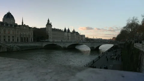 Seine River Bridge in Paris at Sunset with Panning View and Clouds Stock Footage 322098046