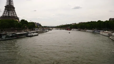 Seine river, Eiffel Tower and river cruises in a cloudy day, Paris, France Stock Footage 237924683