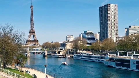 Seine River, Eiffel Tower, Passy Bridge, and Motorboat  Paris, April 3, 2025 Stock Footage 311655117