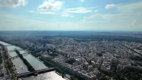 Seine river flowing through the expansive cityscape of paris, france Видео 328006331