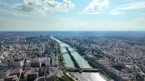 Seine river flowing through the expansive cityscape of paris, france Vídeos de archivo 328023055