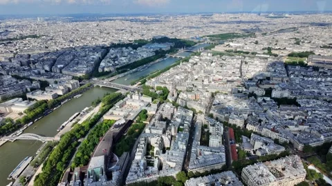 Seine river flowing through the expansive cityscape of paris, france Vídeos de archivo 328023220