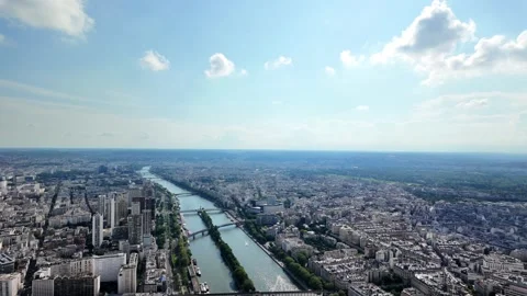 Seine river flowing through the expansive cityscape of paris, france Vídeos de archivo 328023226