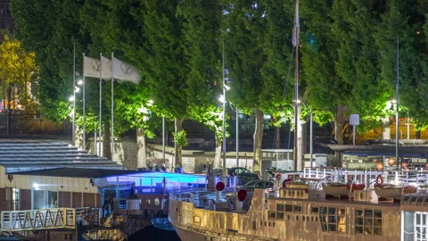 Seine river with ship in Paris at night timelapse, waterfront of the seine river Stock Footage 236709841