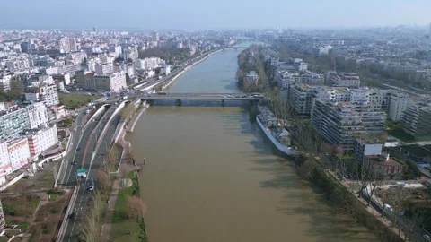 Seine River withars driving on bridge crossing Paris, France. Aerial Stock Footage 270224708