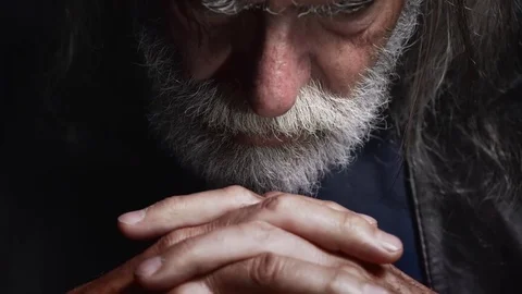 Seious Old man with long white beard looks threatening the camera,darkness Stock Footage 74983035