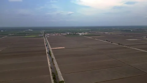Sekinchan Harvested rice fields preparing for cultivation. Gorgeous aerial view Stock Footage 340797853