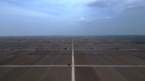 Sekinchan rice fields preparing for cultivation. Dramatic aerial view drone Stock Footage 339826185