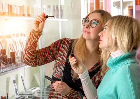 Select the brush with the mascara in the store Stock Photos